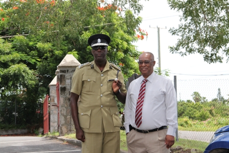Commissioner of Police in the Royal St. Christopher and Nevis Police Force Celvin G. Walwyn with Premier of Nevis Hon. Joseph Parry during a previous visit to Nevis (file photo)